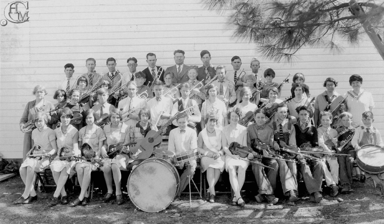 student band members pose with their instruments.