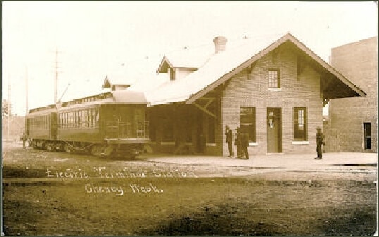 electric train in front of depot